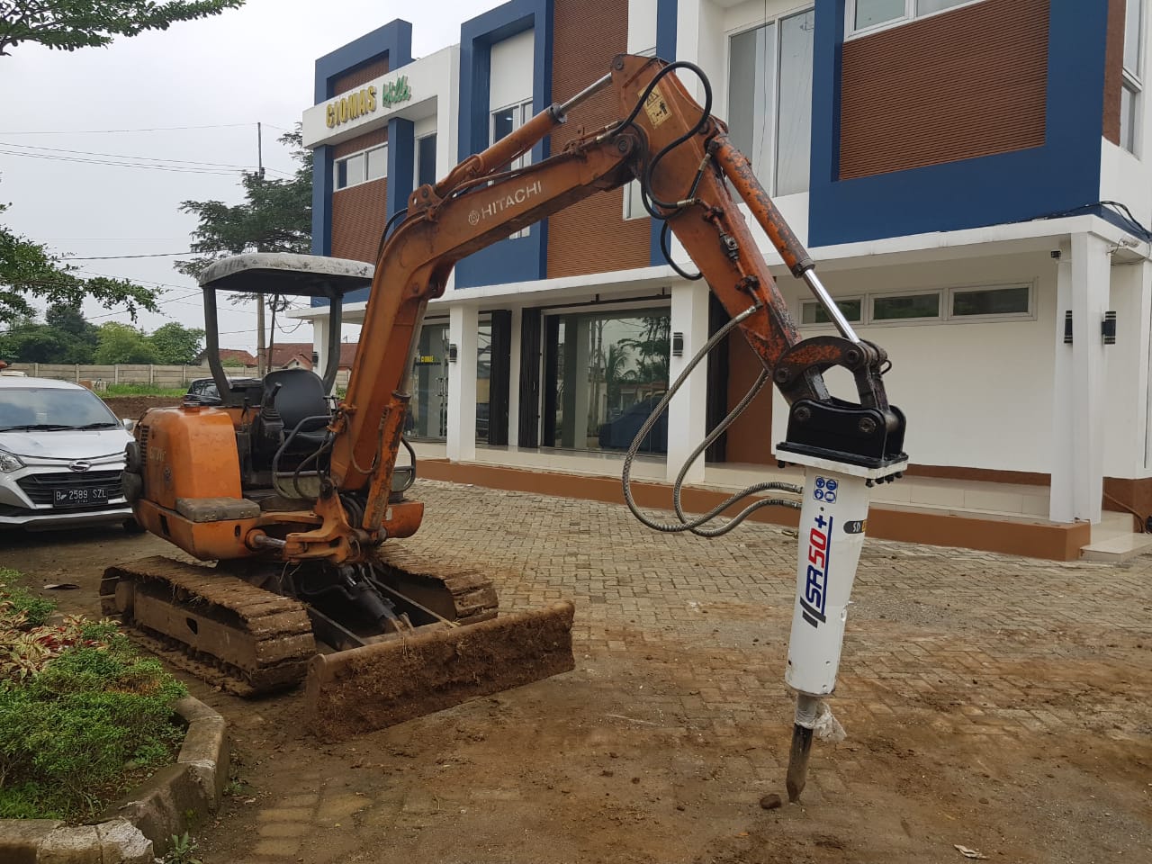 Premium Breaker on an excavator, with the breaker body and chisel visible