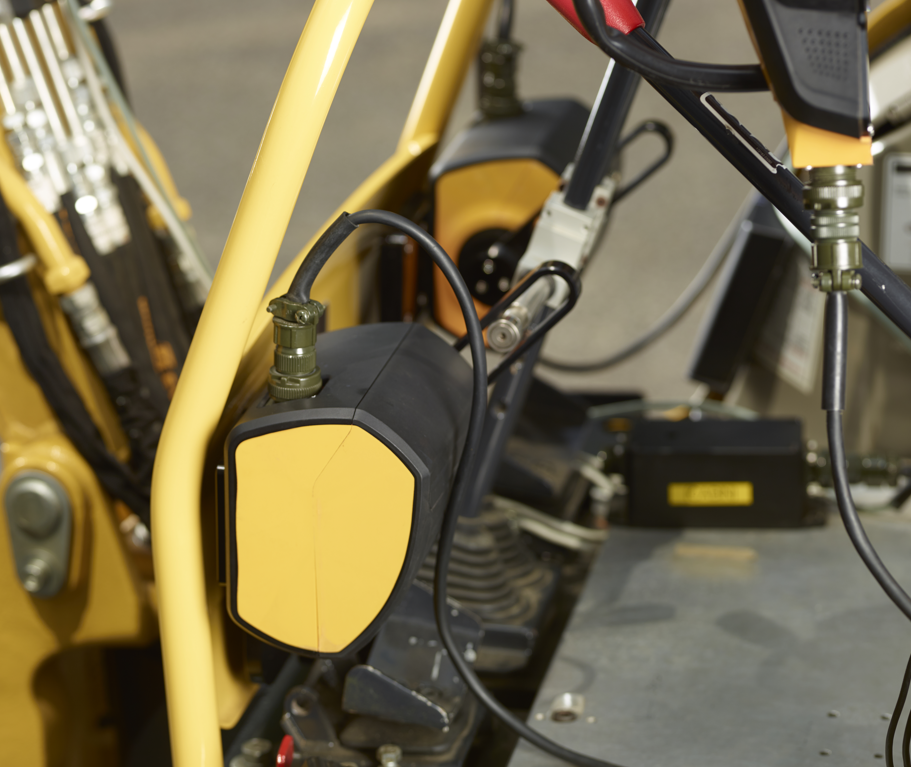 Pedal control robot mounted inside an excavator cab